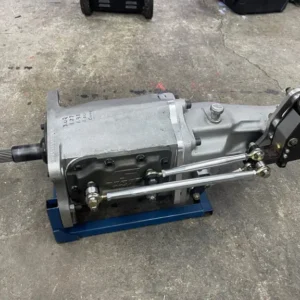 G-Force G101A Transmission, Buy G-Force G101A Transmission, G101A dog gearbox, G101A four ratio gearbox, G101A motorsport manual, G101A competition driveline, G101A performance gearbox, GForce four gear manual, GForce dog engagement gearbox, GForce competition driveline, GForce professional gearbox, GForce motorsport manual, 3.02 first ratio gearbox, 3.02 launch gear, deep first race gearbox, low first competition transmission, drag launch gearing setup, starting line gear multiplication, first gear ratio calculator, acceleration ratio planning, race vehicle gearing setup, competition launch ratio, GM spline race gearbox, GM clutch spline transmission, 26 tooth input gearbox, Chevrolet clutch input shaft, GM race clutch hub, performance input shaft setup, competition clutch spline matching, race input shaft measurement, GM dogbox conversion, Chevrolet racing manual, 32 tooth output gearbox, heavy duty output shaft, hardened slip yoke gearbox, race driveshaft slip yoke, competition output spline, performance driveshaft yoke, drag car yoke setup, motorsport driveshaft connection, high load output shaft, racing driveline yoke, Long H gate shifter, Long four gear shifter, H gate dog gearbox, H pattern competition manual, race H shift mechanism, four gear H shifter, performance shifter linkage, motorsport gear selector, track car H gate, drag H pattern gearbox, single rail race gearbox, internally shifted transmission, internal rail competition gearbox, positive shift race manual, direct engagement race box, faceplate racing gearbox, slider engagement gearbox, race gear engagement system, high speed manual shifting, professional dog engagement, competition shift architecture, center bearing support gearbox, dual bearing transmission support, integrated midplate gearbox, shaft separation control, high load gearbox construction, reinforced racing transmission, extreme duty manual gearbox, competition case rigidity, gear alignment race gearbox, motorsport bearing support, splash lubricated race gearbox, racing transmission gear oil, dogbox lubrication system, competition gearbox fluid, gearbox oil service racing, manual race gearbox maintenance, race transmission oil change, dogbox fluid inspection, performance gearbox lubrication, racing gearbox service interval, faceplate wear inspection, slider wear inspection, dog ring inspection, gear tooth evaluation, shift rail alignment, shift fork alignment, center support inspection, race transmission refresh, competition gearbox rebuild, motorsport transmission servicing, four speed drag gearbox, four speed road race gearbox, four speed drift gearbox, competition four speed manual, professional drag transmission, road course racing gearbox, drift car dog transmission, time attack race gearbox, track car four speed, purpose built motorsport gearbox, high output manual transmission, high torque competition gearbox, boosted race drivetrain, naturally aspirated race gearbox, turbo drag manual gearbox, supercharged race transmission, high power stick shift setup, competition powertrain gearbox, performance driveline upgrade, professional racing drivetrain, clutch assisted G101A, clutchless G101A setup, competition clutch adjustment, drag clutch configuration, race clutch pressure setup, performance clutch engagement, racing pressure plate selection, clutch disc spline fitment, pilot bearing race setup, flywheel gearbox compatibility, race bellhousing alignment, transmission concentric alignment, competition bellhousing setup, manual gearbox pilot support, race transmission installation, gearbox crossmember setup, transmission tunnel fitment, shifter setback measurement, race drivetrain alignment, custom driveshaft measurement, motorsport transmission mount, racing gearbox parts supplier, G101A replacement components, G101A faceplate parts, G101A slider components, G101A bearing kit, G101A input shaft parts, dogbox replacement gears, racing gearbox spare components, competition transmission hardware, motorsport gearbox repair parts, used G101A dealer, racing gearbox marketplace, competition transmission retailer, professional gearbox supplier, used dogbox seller, motorsport drivetrain store, high performance transmission shop, race manual gearbox dealer, competition parts retailer, specialist transmission supplier, four speed dogbox sale, H pattern gearbox sale, GM spline gearbox sale, performance transmission package, race gearbox purchase, used motorsport manual sale, competition drivetrain package, professional dogbox purchase, racing manual transmission sale, track gearbox package, race transmission freight, gearbox pallet shipping, competition gearbox delivery, motorsport drivetrain transport, nationwide transmission freight, international gearbox logistics, heavy driveline shipping, race parts transportation, gearbox crate delivery, performance transmission freight, TorqueLine GForce gearboxes, TorqueLine dogbox transmissions, TorqueLine drag drivetrains, TorqueLine race manuals, TorqueLine competition gearboxes, TorqueLine used transmissions, TorqueLine motorsport components, TorqueLine performance drivetrains, TorqueLine gearbox shipping, TorqueLine racing parts