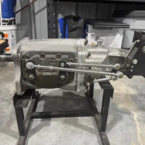 G-Force G101A Transmission, Buy G-Force G101A Transmission, 3.17 ratio racing gearbox, deep ratio competition manual, low ratio drag gearbox, launch gear motorsport transmission, starting gear race car, acceleration ratio race gearbox, race car launch gearing, first ratio motorsport setup, drag launch multiplication, competition gearing calculation, four ratio competition gearbox, professional four gear manual, motorsport four speed gearbox, race only manual transmission, purpose built competition box, track four gear transmission, extreme duty racing manual, performance four ratio gearbox, specialist motorsport manual, race vehicle gearbox, dog engagement racing box, dog clutch competition gearbox, positive engagement manual, non synchronized race transmission, face dog gearbox setup, racing engagement mechanism, rapid shift dogbox, track dog engagement transmission, professional dog clutch gearbox, motorsport engagement system, 26 tooth input shaft, GM clutch spline gearbox, racing clutch spline shaft, competition input spline, performance clutch hub setup, clutch disc spline matching, race clutch shaft specification, gearbox input measurement, manual racing input shaft, high load clutch spline, 32 tooth output shaft, heavy duty transmission output, hardened driveshaft yoke, competition slip yoke, race driveline output spline, performance prop shaft yoke, high strength driveshaft connection, drag vehicle output shaft, motorsport yoke specification, race driveline coupling, center bearing race gearbox, dual bearing gearbox support, reinforced transmission midplate, race gearbox case rigidity, shaft spread prevention, high load gear alignment, competition transmission structure, motorsport shaft support, reinforced four speed gearbox, extreme load transmission case, single rail racing shifter, internal shift rail gearbox, internally shifted race transmission, positive shift mechanism, precision racing shifter, dogbox gear selector, motorsport shift rail, race shift fork system, competition gear selector mechanism, racing manual shift control, H gate racing option, V gate racing option, race shifter setback, competition shifter positioning, motorsport cockpit shifter, drag shifter configuration, road race shifter setup, drift transmission shifter, custom race shifter location, transmission tunnel shifter fitment, splash oil racing gearbox, splash lubricated transmission, race gearbox lubricant, dogbox gear oil service, competition transmission fluid, performance gearbox oil change, racing manual lubrication, transmission fluid inspection, dogbox maintenance fluid, gearbox lubrication guide, drag racing four gear box, road circuit four speed, drift car race gearbox, time attack transmission, track competition manual, hill climb dogbox, race prepared gearbox, dedicated motorsport transmission, professional race drivetrain, stick shift competition setup, clutch assisted race setup, clutchless race gearbox setup, racing clutch configuration, competition pressure plate setup, drag clutch tuning, race clutch engagement control, high performance clutch system, manual drag drivetrain, competition clutch selection, racing flywheel compatibility, bellhousing alignment procedure, pilot bearing race setup, input shaft pilot support, manual gearbox installation, competition crossmember setup, racing transmission mount, custom gearbox installation, race driveline alignment, driveshaft measurement procedure, output yoke fitment, performance drivetrain setup, faceplate transmission service, dog ring inspection service, slider inspection gearbox, race gear tooth inspection, center support service, shift fork alignment service, competition transmission refresh, racing gearbox rebuild, professional dogbox maintenance, used racing gearbox inspection, replacement faceplate components, dogbox slider replacement, racing transmission bearing kit, performance gearbox seals, reverse gear service parts, race transmission input replacement, competition gearbox hardware, motorsport gearbox spare parts, professional transmission components, race gearbox parts catalog, used four speed race gearbox, competition dogbox dealer, motorsport transmission supplier, professional racing gearbox seller, performance manual transmission store, track gearbox marketplace, drag racing transmission supplier, race drivetrain parts dealer, used motorsport transmission, specialist dogbox retailer, four speed race transmission sale, competition dogbox package, high performance manual sale, drag gearbox buying guide, track transmission purchase, motorsport gearbox package, professional racing manual sale, used dogbox purchase, competition drivetrain sale, racing gearbox package, transmission pallet freight, competition gearbox shipping, motorsport transmission delivery, heavy gearbox transport, race drivetrain freight, international transmission shipping, nationwide gearbox delivery, racing parts logistics, performance driveline transport, gearbox crate freight, TorqueLine race transmissions, TorqueLine four speed gearboxes, TorqueLine dogbox parts, TorqueLine competition manuals, TorqueLine motorsport drivetrains, TorqueLine used gearboxes, TorqueLine performance transmissions, TorqueLine racing components, TorqueLine gearbox delivery, TorqueLine drivetrain parts