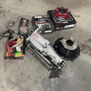 G-Force G101A Transmission, Buy G-Force G101A Transmission, G101A race gearbox, G101A four speed, G101A drag gearbox, GForce competition manual, GForce faceplate gearbox, GForce clutch assisted gearbox, GForce drag racing manual, GForce motorsport gearbox, GForce high load transmission, GForce racing driveline, LS Mustang race gearbox, LS swapped Mustang transmission, LS Mustang drag drivetrain, Chevrolet powered Mustang gearbox, LS Foxbody race transmission, LS SN95 racing gearbox, LS New Edge drag transmission, LS Mustang stick shift setup, LS swap manual race gearbox, LS Ford drag car drivetrain, 1-3/8 input race gearbox, ten spline racing input, large input shaft transmission, competition input shaft setup, heavy duty clutch spline, ten spline clutch hub, race gearbox input dimensions, manual transmission input upgrade, drag car clutch spline, performance input shaft, eleven inch drag clutch, adjustable drag clutch system, sintered iron racing clutch, centrifugal clutch adjustment, clutch counterweight tuning, drag launch clutch setup, soft engagement race clutch, single disc competition clutch, drag clutch pressure adjustment, racing clutch base pressure, spare race clutch assembly, replacement competition clutch disc, race clutch rebuild parts, drag clutch service kit, racing clutch maintenance, billet driveshaft yoke, race transmission yoke, high strength driveline yoke, drag car output yoke, performance driveshaft connection, competition U joint setup, racing driveshaft hardware, stick shift driveline parts, manual race car driveshaft, high power drivetrain yoke, hydraulic Mustang clutch conversion, Mustang hydraulic release system, race car clutch hydraulics, hydraulic throwout bearing setup, clutch master cylinder conversion, Mustang clutch line conversion, drag car hydraulic clutch, race clutch pedal hydraulics, hydraulic clutch travel setup, manual swap hydraulic system, slipper clutch controller, Hitmaster clutch control, launch clutch management, drag car clutch timer, adjustable clutch release control, race launch management, tire hit control system, manual drag launch tuning, clutch engagement controller, stick shift traction control setup, billet race shifter, setback transmission shifter, raised race shifter, custom Mustang shifter position, drag car shifter ergonomics, billet manual shifter assembly, racing transmission shift lever, competition cockpit shifter, manual gearbox shifter relocation, stick shift race shifter, LS racing bellhousing, LS manual bellhousing setup, adjustable clutch bellhousing, bellhousing inspection window, race clutch access window, LS transmission adapter housing, Chevrolet LS race bellhousing, drag racing bellhousing setup, manual LS swap housing, competition bellhousing alignment, faceplate racing transmission, third gear faceplate service, fourth gear faceplate service, racing slider replacement, transmission slider service, faceplate engagement system, race gearbox engagement repair, manual transmission slider inspection, drag gearbox internal service, competition transmission refresh, fifteen pass race transmission, low pass gearbox service, recently serviced race gearbox, racing transmission maintenance history, drag gearbox inspection, stick shift race transmission service, faceplate wear inspection, slider wear inspection, competition gearbox teardown, manual race transmission rebuild, high power Mustang transmission, high horsepower LS drivetrain, stick shift drag Mustang, manual LS drag car, race prepared Mustang gearbox, competition Mustang powertrain, LS drag racing components, Ford chassis LS drivetrain, Mustang race clutch setup, high power manual conversion, drag racing four speed, road racing GForce gearbox, drift GForce transmission, competition four speed manual, purpose built race gearbox, manual motorsport transmission, high load four speed gearbox, drag car transmission package, race car manual drivetrain, professional racing gearbox, used GForce transmission dealer, race gearbox parts supplier, drag transmission marketplace, performance drivetrain retailer, used manual race gearbox, competition transmission seller, high power gearbox supplier, motorsport transmission dealer, race car driveline store, complete drag gearbox package, LS transmission package sale, Mustang race drivetrain sale, stick shift race package, used drag transmission sale, complete competition gearbox, high power manual gearbox sale, race clutch transmission package, drag racing driveline package, manual competition parts sale, race transmission pallet shipping, drag gearbox freight service, performance drivetrain delivery, manual gearbox crate shipping, competition transmission transport, nationwide race gearbox freight, international drivetrain logistics, heavy transmission shipping, motorsport powertrain freight, race parts transportation, TorqueLine GForce gearboxes, TorqueLine LS transmissions, TorqueLine Mustang drivetrains, TorqueLine drag gearboxes, TorqueLine competition manuals, TorqueLine clutch packages, TorqueLine used transmissions, TorqueLine racing drivetrains, TorqueLine gearbox freight, TorqueLine performance parts