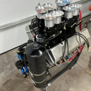 410 Sprint Engine, Buy 410 Sprint Engine, Donovan race motor for sale, Donovan aluminum racing block, Donovan dirt track motor, 286-2 racing heads, 286cc competition heads, All Pro dirt track heads, Shaver built racing motor, Shaver performance V8, Ron Shaver racing motor, fresh dirt racing powerplant, professional engine freshen, newly serviced competition V8, Barnes dry sump system, Barnes racing lubrication, new racing oil pump, multi stage lubrication pump, KSE cooling pump, KSE crank drive pump, sprint cooling hardware, Wesmar timing gears, Shaver Wesmar drive, race cam gear system, competition gear drive, T&D shaft rockers, T&D steel valvetrain, spring oiler system, race valve spring oiling, Carrillo 5.850 rods, Carrillo H beam rods, forged racing connecting rods, new competition rods, JE forged race pistons, new forged pistons, high compression racing pistons, BAM roller lifters, BAM racing valvetrain, competition pushrod set, new racing pushrods, Engler stack injection, Engler throttle bodies, 2.900 mechanical injection, rebuilt race injection, methanol stack injection, MSD racing magneto, rebuilt race magneto, Pro Mag ignition system, competition ignition magneto, BMRS lightweight plumbing, Brown Miller racing hoses, race fluid fittings, new motorsport plumbing, Dan Olson racing pan, Dan Olson valve covers, racing dry sump pan, competition valve covers, dyno documented engine, race motor dyno sheets, documented performance motor, engine dyno records, verified racing powerplant, dyno tested dirt engine, professional sprint motor, winged oval powerplant, non wing oval motor, methanol dirt racing V8, naturally aspirated competition V8, high RPM dirt powerplant, open wheel racing engine, oval competition powerplant, professional dirt motor, championship racing V8, race team powerplant, purpose built oval motor, fresh competition motor for sale, rebuilt racing V8 for sale, serviced dirt engine, race ready powerplant, low time fresh motor, competition engine package, complete dirt motor, specialist oval engine, professional motorsport V8, racing engine valvetrain, shaft rocker racing motor, high lift cam valvetrain, race spring lubrication, competition lifter setup, racing pushrod geometry, valvetrain stability guide, high RPM valve control, racing cam drive, gear driven camshaft, dry sump race lubrication, racing oil scavenging, engine oil pressure setup, race motor priming procedure, competition oil tank setup, dry sump hose routing, racing cooling system setup, crank driven water pump, dirt motor temperature control, race radiator plumbing, mechanical fuel injection tuning, methanol nozzle selection, barrel valve adjustment, high speed bypass tuning, race fuel pressure setup, competition fuel delivery, sprint fuel pump setup, magneto timing adjustment, race ignition timing, MSD magneto service, competition spark setup, race engine startup procedure, fresh engine break in, racing motor warm up, competition engine inspection, pre race motor checklist, racing valve lash check, dirt engine maintenance, race motor service intervals, professional engine teardown, competition motor rebuild, race engine refresh schedule, dirt motor longevity, race engine build documentation, racing component specifications, competition engine build sheet, motorsport dyno testing, racing torque curve, track engine horsepower chart, race engine performance data, dirt powertrain setup, oval racing drivetrain, open wheel driveline, race engine mounting, motor plate installation, sprint torque tube setup, racing rear end compatibility, dirt track gearing, competition exhaust headers, methanol fuel plumbing, motorsport fabrication, racing powertrain installation, used race engine dealer, dirt motor supplier, oval powerplant retailer, professional race engine shop, motorsport motor marketplace, competition V8 sales, performance racing engine dealer, specialty dirt parts store, open wheel parts supplier, race team component store, engine freight shipping, racing motor pallet freight, competition V8 transportation, motorsport engine logistics, nationwide race motor delivery, race powerplant collection, TorqueLine Donovan engines, TorqueLine Shaver motors, TorqueLine dirt powerplants, TorqueLine racing engines, TorqueLine oval motors, TorqueLine motorsport parts, TorqueLine used performance engines, TorqueLine competition components, TorqueLine race engine support, TorqueLine engine sales